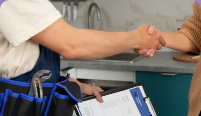 Technician shaking hands with homeowner