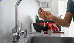 Technician repairing a sink