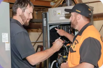 Technicians working in a Kansas City home